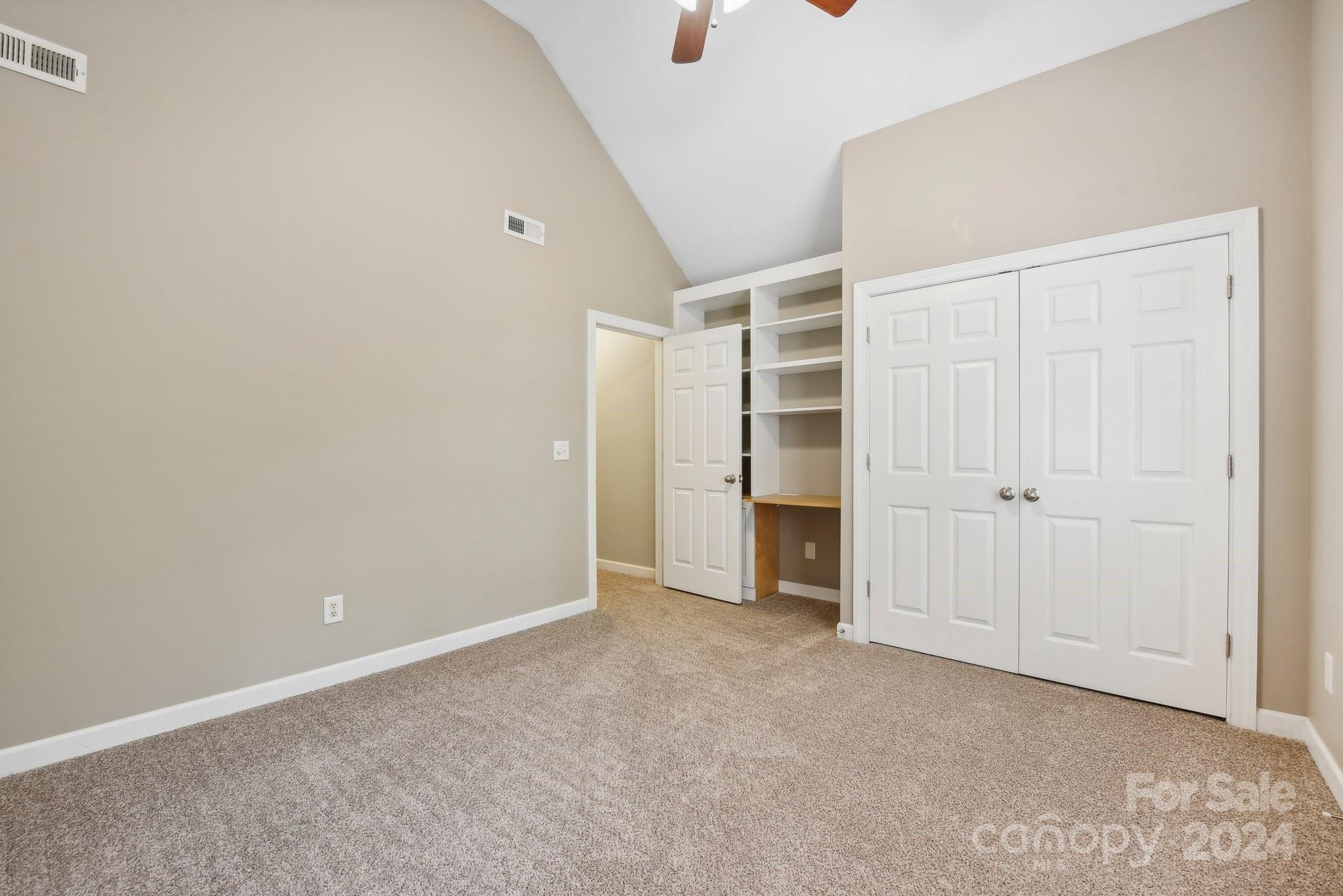 1013 Wesley Downs Road Monroe, NC 28110 - Photo 27 of 41 an empty room with closet and a window