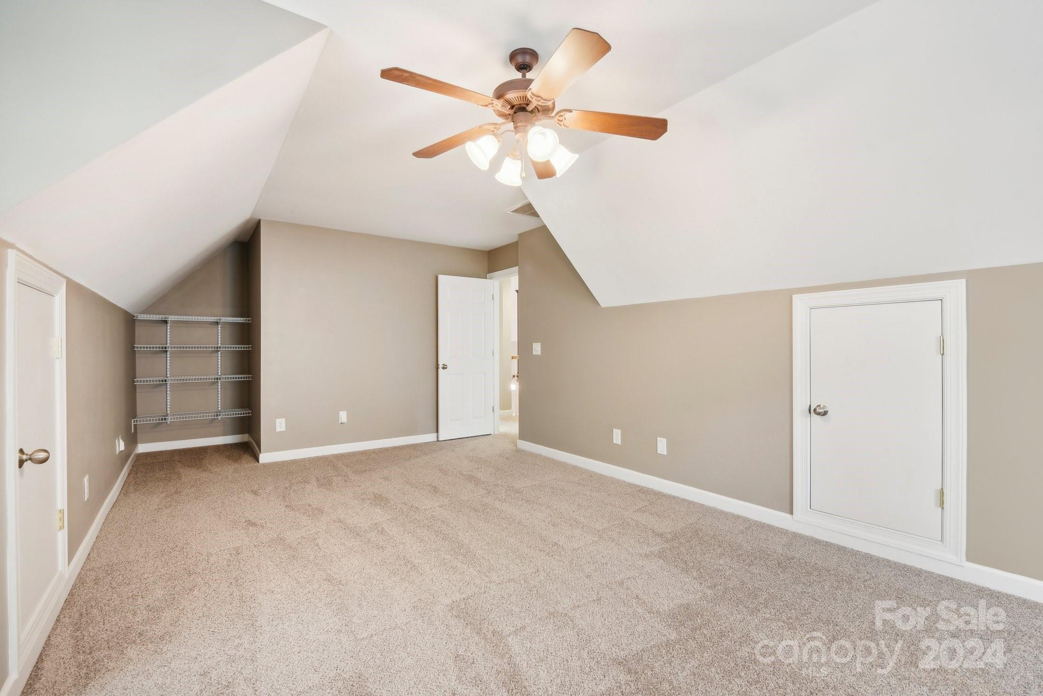 1013 Wesley Downs Road Monroe, NC 28110 - Photo 29 of 41 a view of an empty room with a chandelier fan