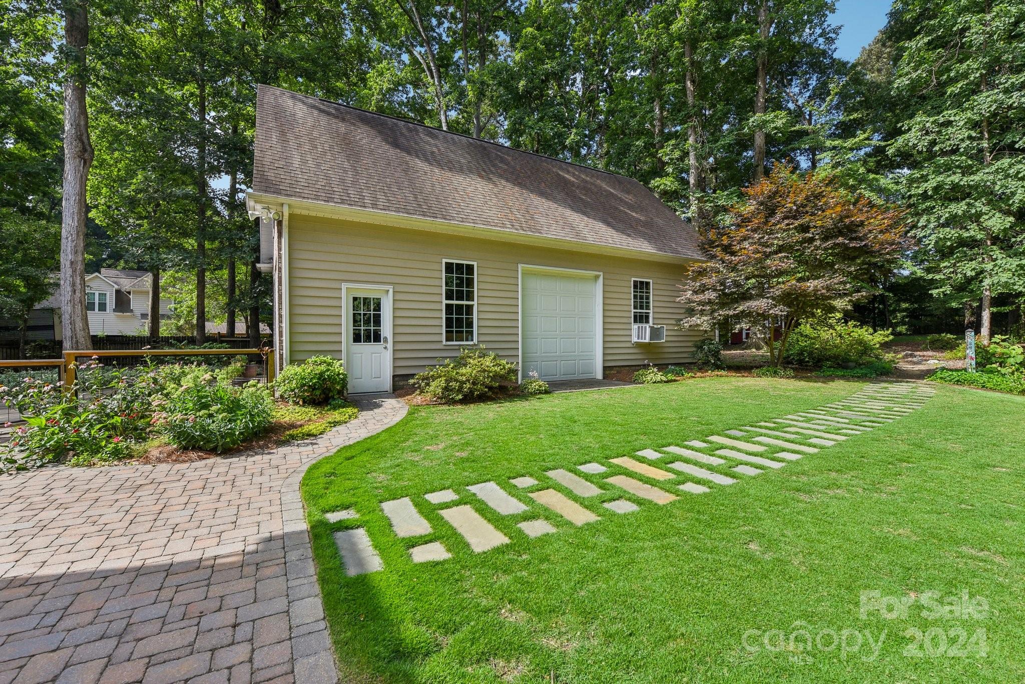 1013 Wesley Downs Road Monroe, NC 28110 - Photo 34 of 41 a view of a house with a yard