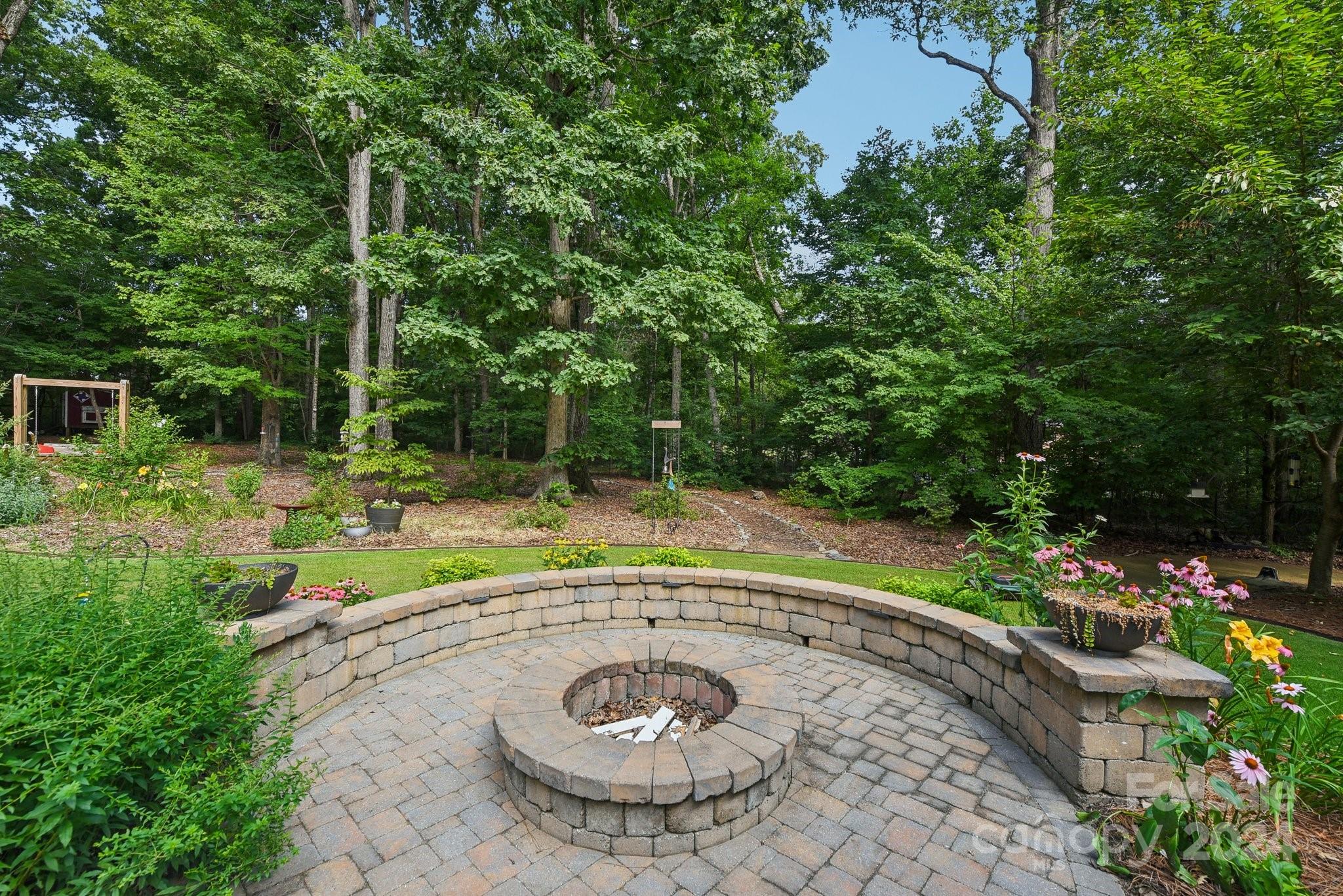 1013 Wesley Downs Road Monroe, NC 28110 - Photo 36 of 41 a view of a swimming pool with a yard