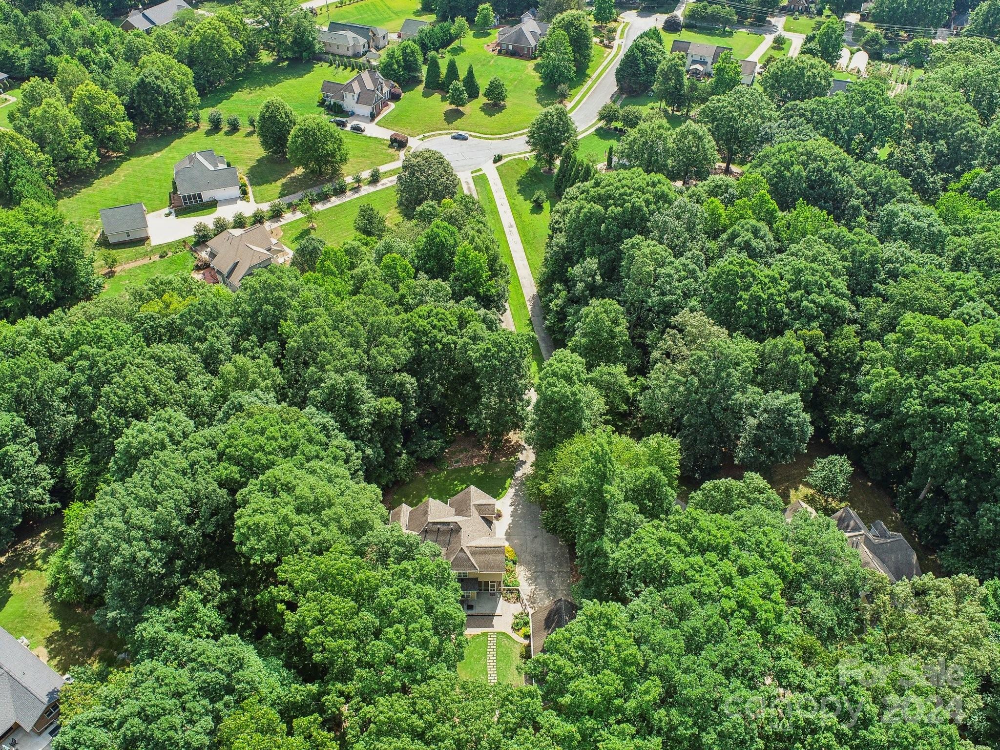 1013 Wesley Downs Road Monroe, NC 28110 - Photo 41 of 41 an aerial view of residential house with outdoor space and trees all around