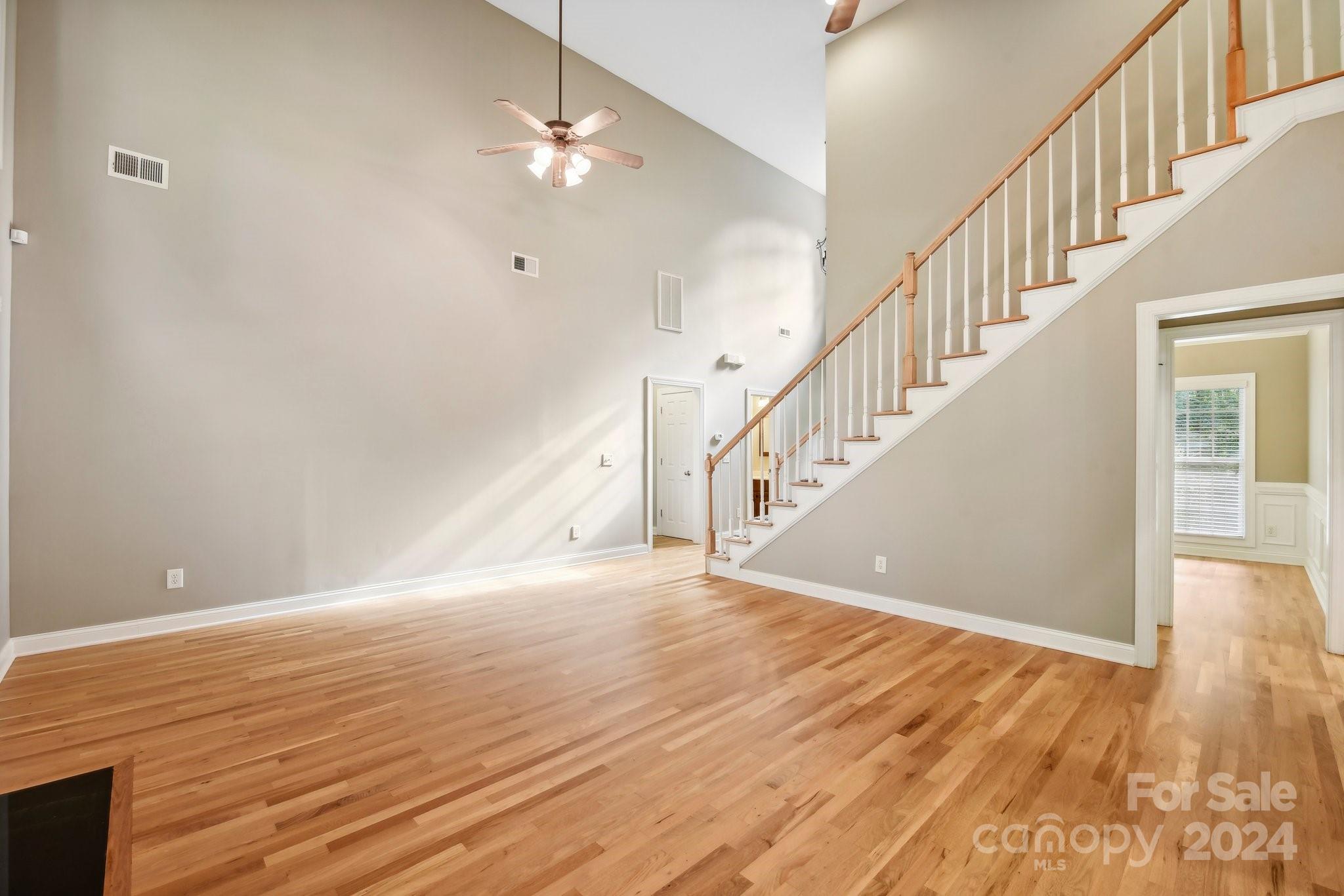 1013 Wesley Downs Road Monroe, NC 28110 - Photo 8 of 41 a view of an empty room with wooden floor