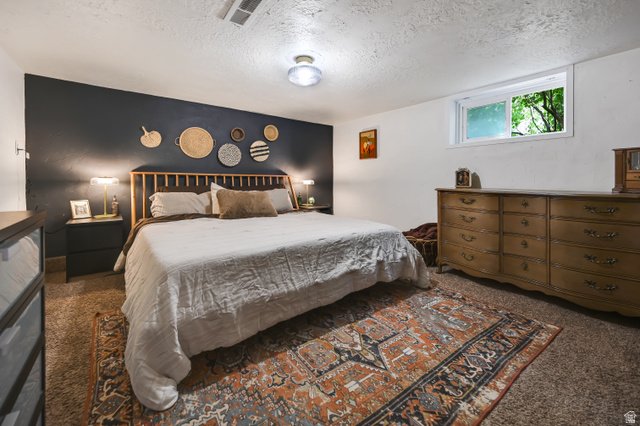 331 West 300 North Logan, UT 84321 - Photo 14 of 28 Spacious bedroom featuring a prominent accent wall