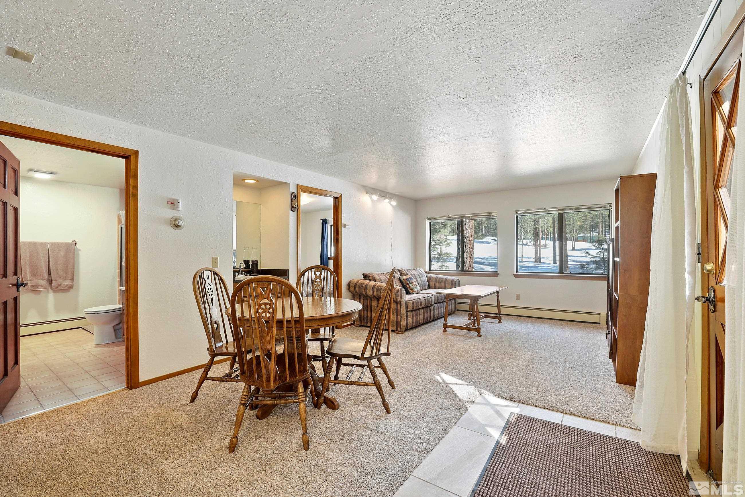 84 Rubicon Circle North, Unit C Stateline, NV 89449 - Photo 15 of 22 a view of a dining room with furniture window and outside view