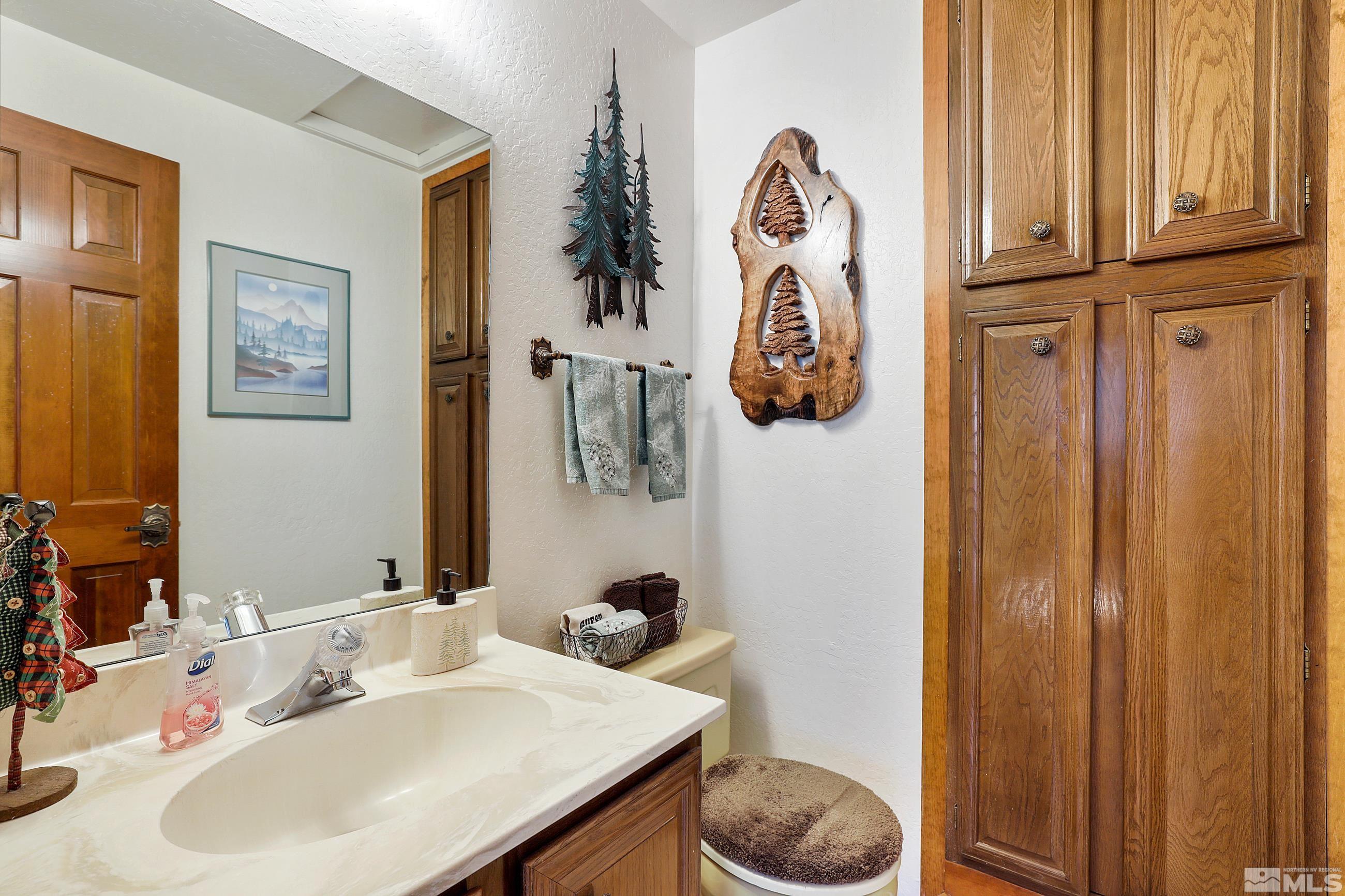 84 Rubicon Circle North, Unit C Stateline, NV 89449 - Photo 19 of 22 a bathroom with a sink and a mirror