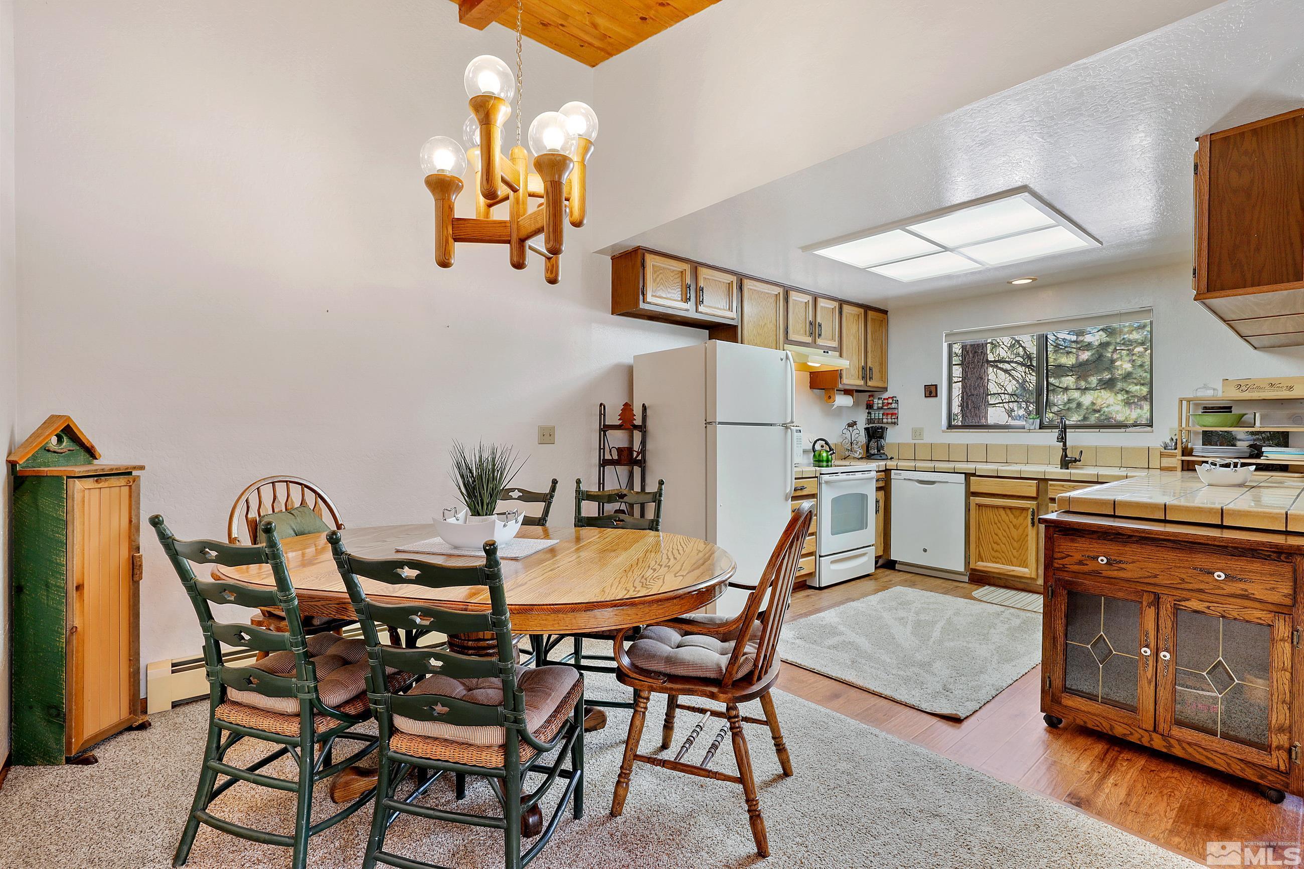 84 Rubicon Circle North, Unit C Stateline, NV 89449 - Photo 9 of 22 a dining room with furniture and wooden floor