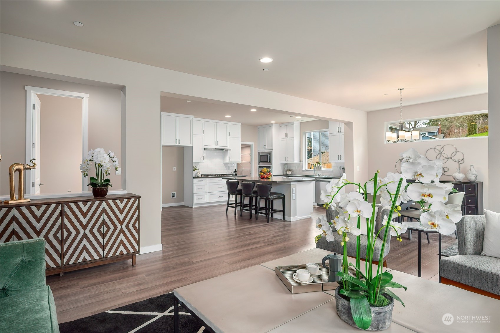 24230 Brier Road Brier, WA 98036 - Photo 14 of 40 a living room with furniture and a dining table with kitchen view
