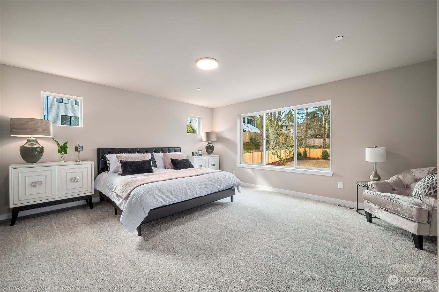 24230 Brier Road Brier, WA 98036 - Photo 19 of 40 a spacious bedroom with a bed and a couch