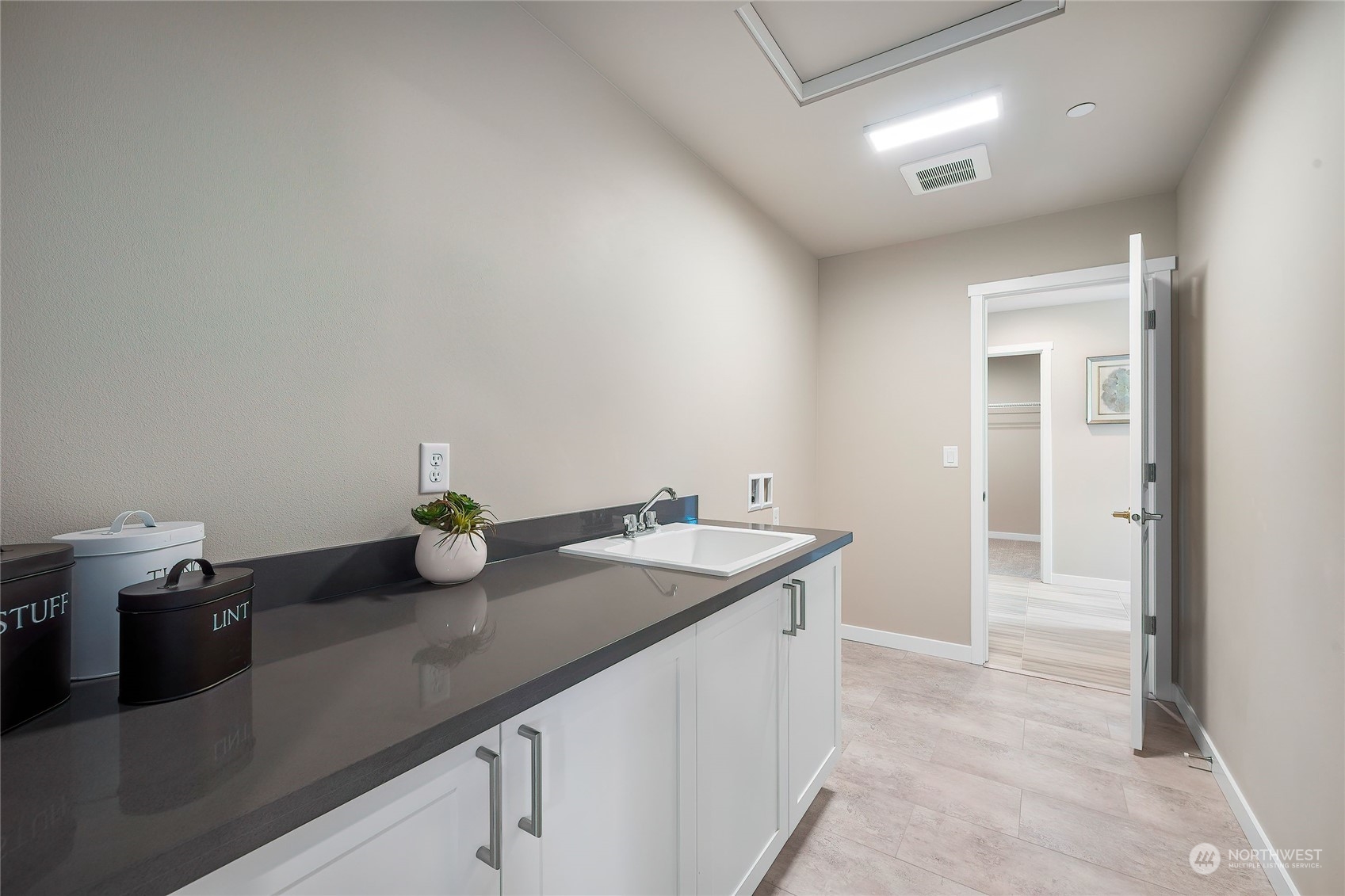 24230 Brier Road Brier, WA 98036 - Photo 30 of 40 a kitchen with a sink and cabinets