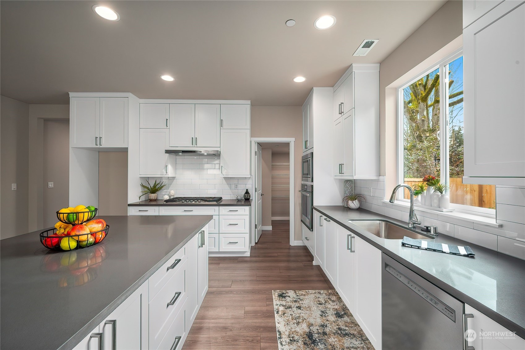 24230 Brier Road Brier, WA 98036 - Photo 7 of 40 a kitchen with granite countertop a sink stove and refrigerator