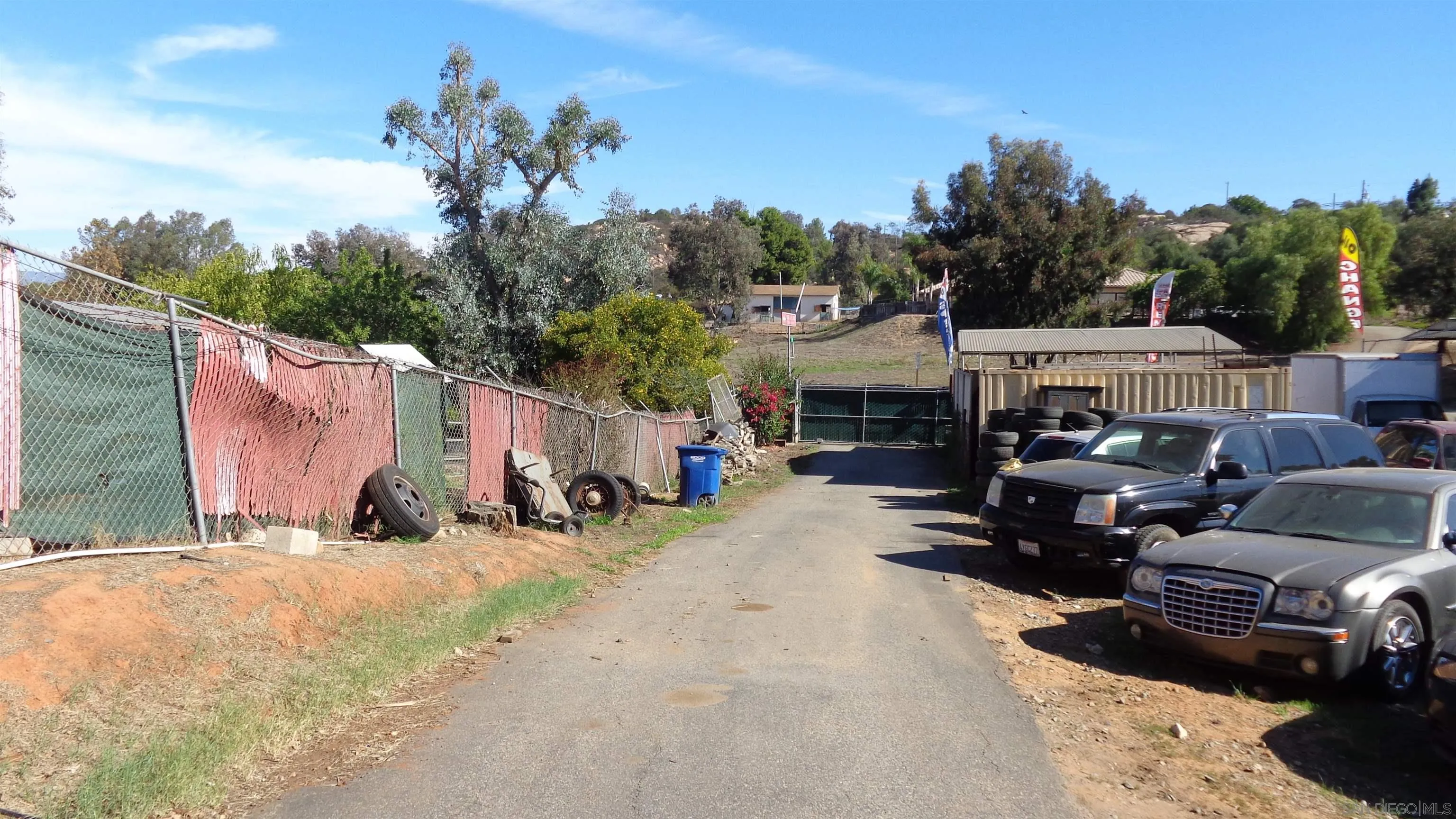 a view of a backyard with a car parked in it