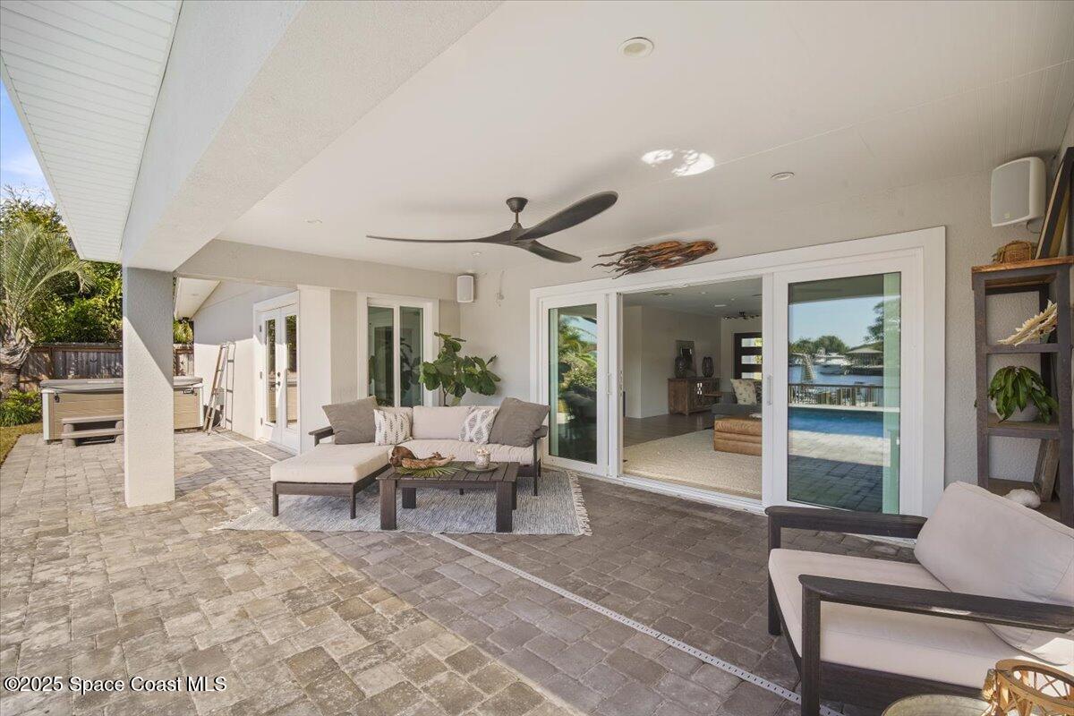 1125 Samar Road Cocoa Beach, FL 32931 - Photo 16 of 46 a living room with furniture and a large window