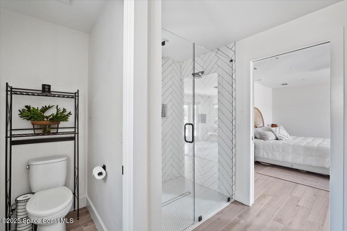 1125 Samar Road Cocoa Beach, FL 32931 - Photo 27 of 46 a en suite bathroom with a shower