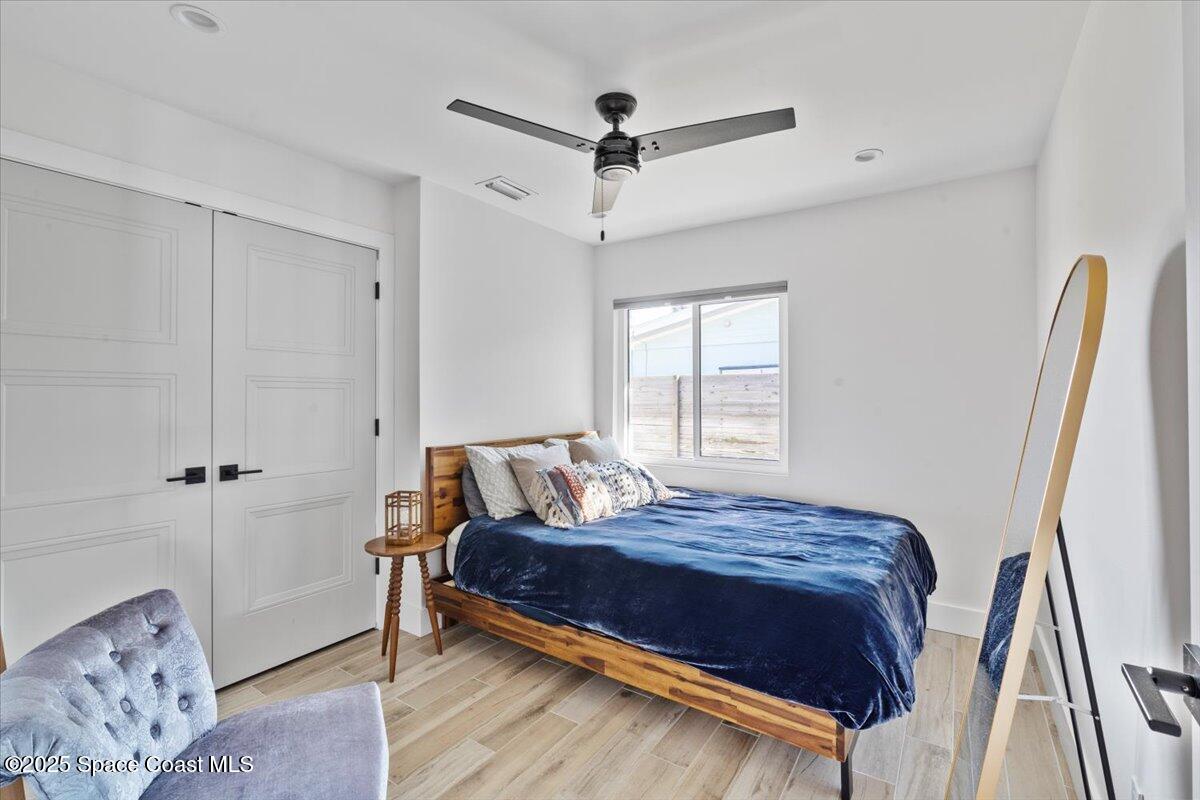 1125 Samar Road Cocoa Beach, FL 32931 - Photo 34 of 46 a bedroom with a bed and a window