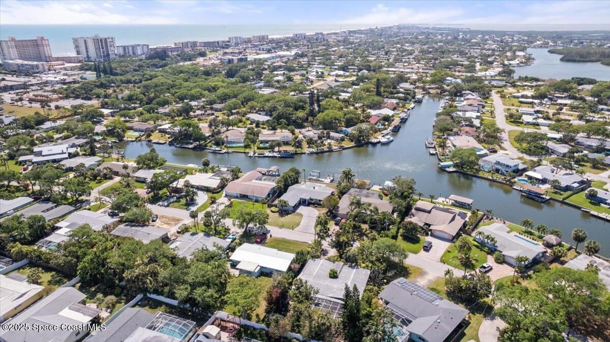 1125 Samar Road Cocoa Beach, FL 32931 - Photo 41 of 46 an aerial view of a city with lots of residential buildings