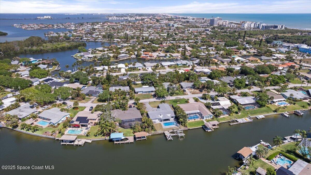 1125 Samar Road Cocoa Beach, FL 32931 - Photo 43 of 46 an aerial view of a city with lots of residential buildings
