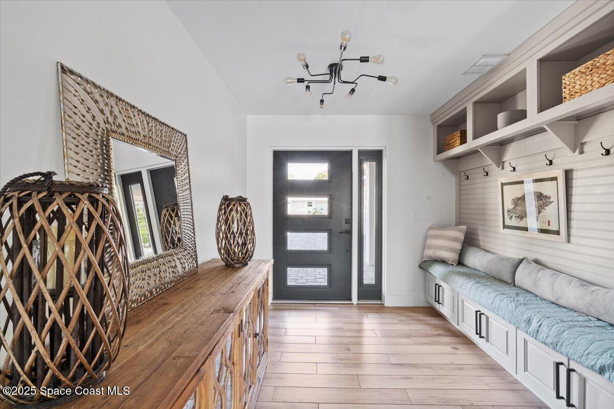 1125 Samar Road Cocoa Beach, FL 32931 - Photo 8 of 46 a living room with furniture and wooden floor