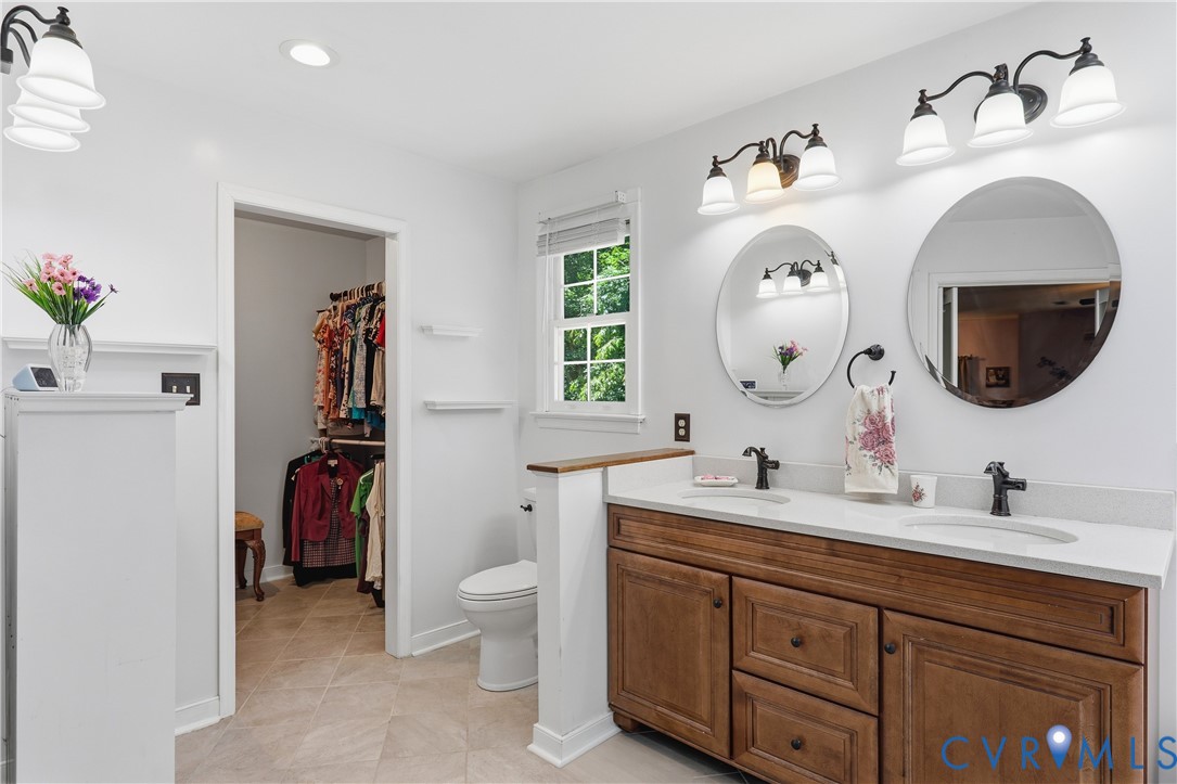 12512 2nd Branch Road Chesterfield, VA 23838 - Photo 30 of 56 a en suite bathroom with a double vanity sink and a mirror