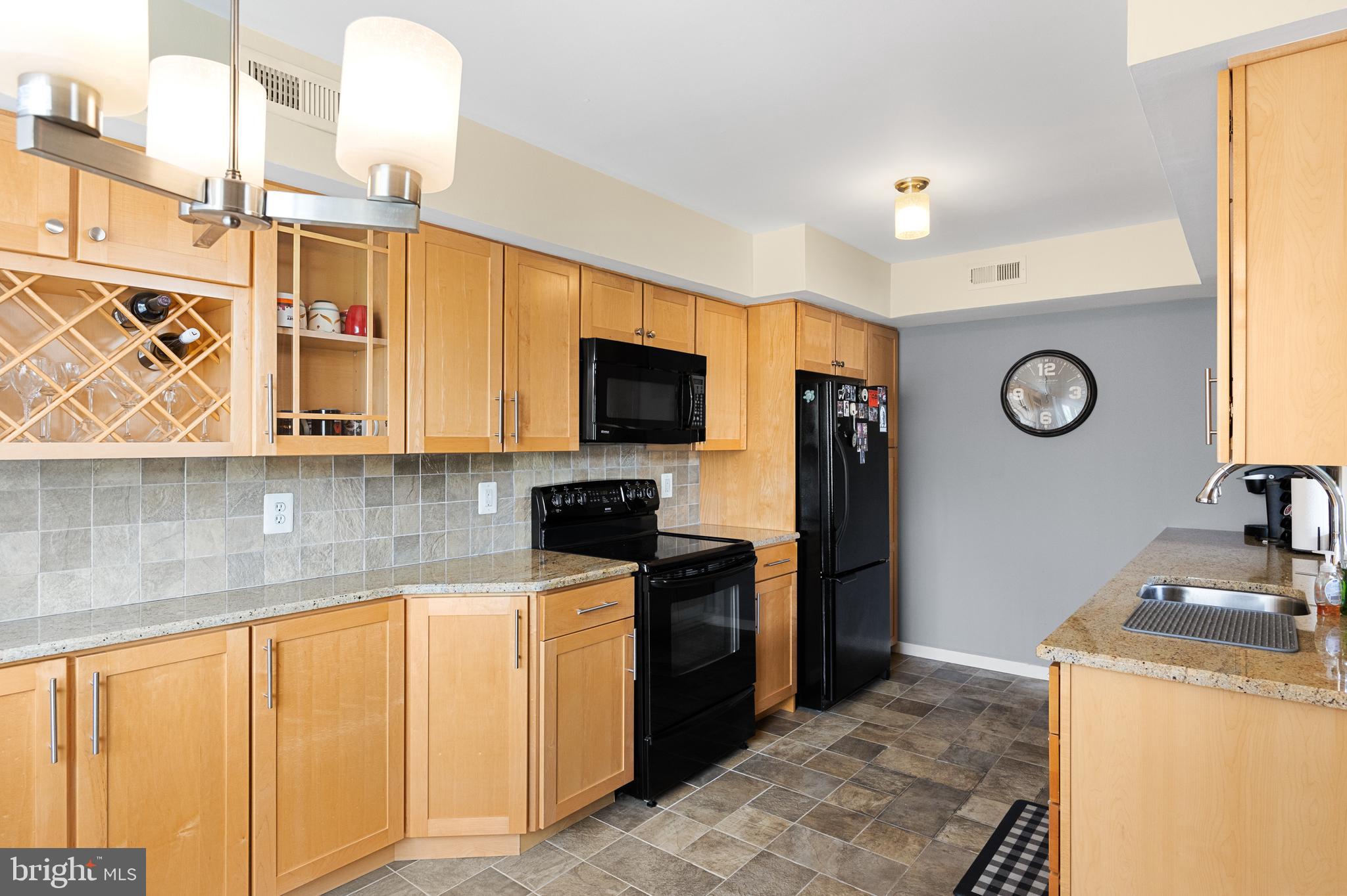 2208 Sandra Road Voorhees, NJ 08043 - Photo 6 of 28 a kitchen with stainless steel appliances granite countertop a sink and a stove