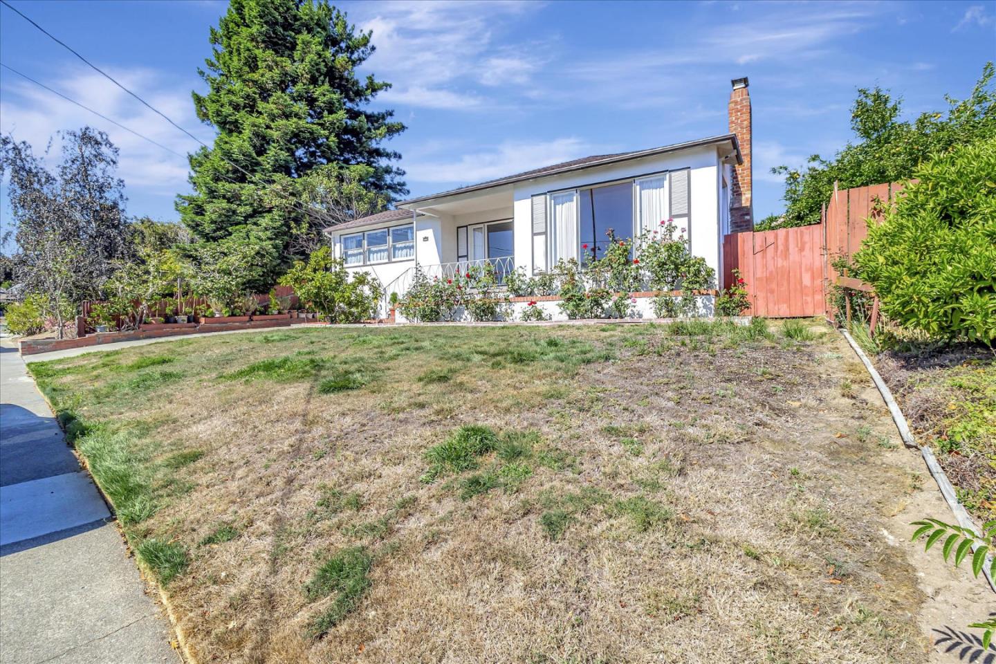 508 Park Boulevard Millbrae, CA 94030 - Photo 2 of 24 a front view of a house with garden
