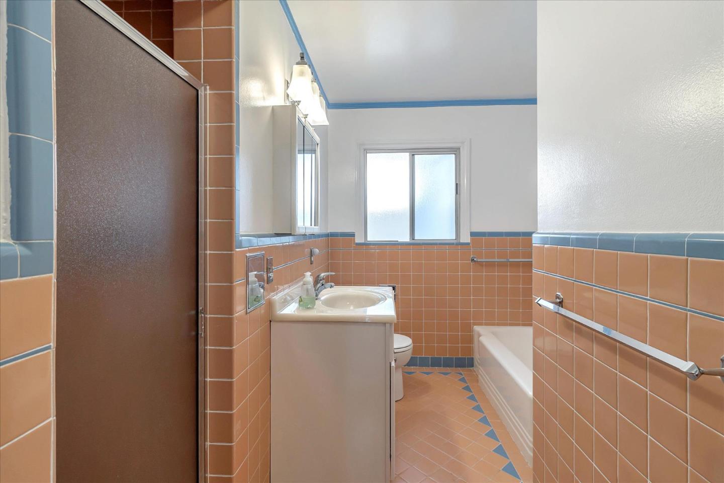508 Park Boulevard Millbrae, CA 94030 - Photo 8 of 24 a bathroom with a sink a toilet and mirror