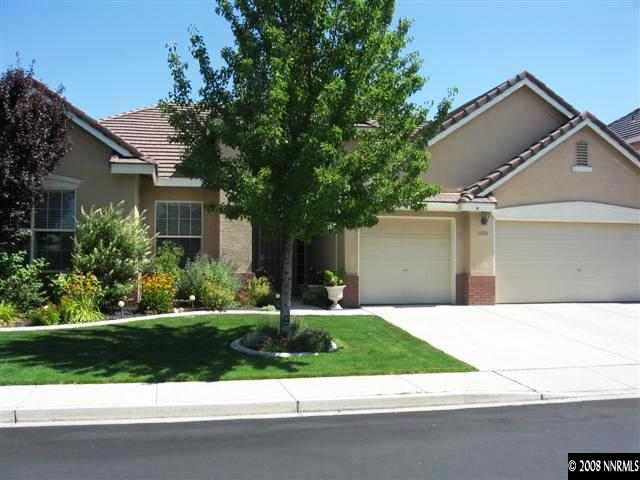 9660 Rolling Rock Way Reno, NV 89521 - Photo 1 of 9 a backyard of a house with lots of green space