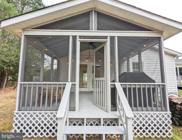 a view of a brick house with a porch