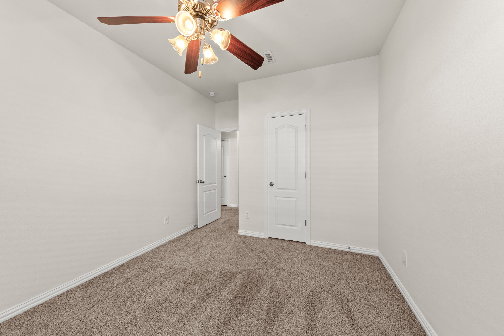 411 Tascate Street Georgetown, TX 78628 - Photo 28 of 41 Well-lit and tranquil, this bedroom provides a perfect blank canvas for your personal style.