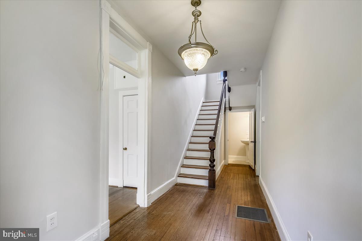104 Chestnut Street Gaithersburg, MD 20877 - Photo 15 of 44 Center hall entrance and stairs to upper level