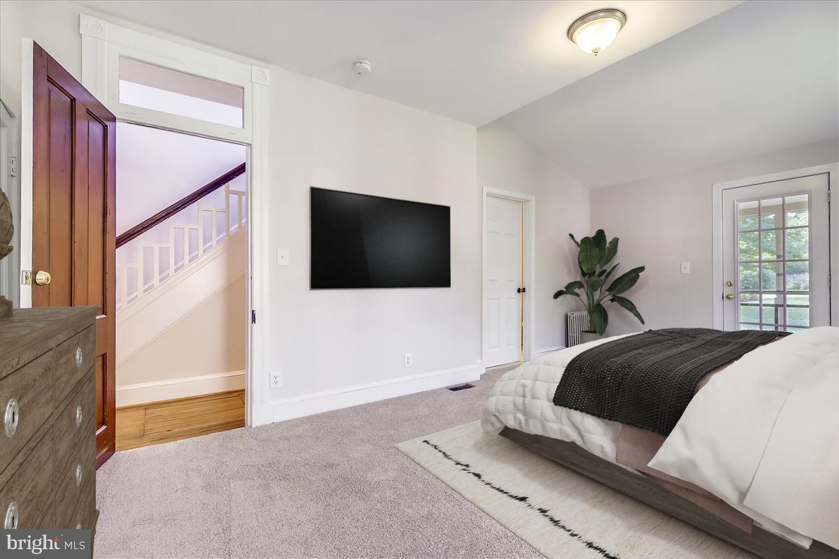 104 Chestnut Street Gaithersburg, MD 20877 - Photo 21 of 44 Main floor primary bedroom with exit door to patio