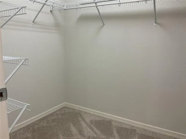 a view of a room with racks on the wall