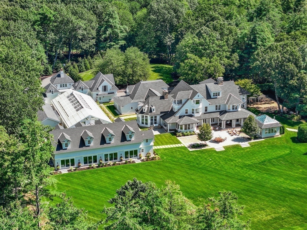 a aerial view of multiple houses with yard