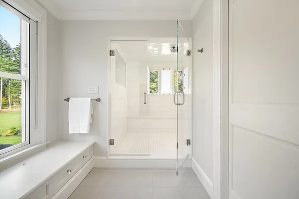 a bathroom with a shower and a tub