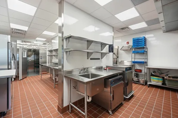 a kitchen with stainless steel appliances granite countertop a sink and a cabinets