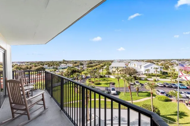 a view of a balcony with an ocean view