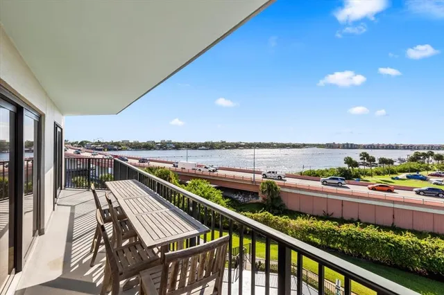 a balcony with furniture and city view