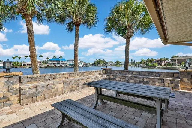 a view of a roof deck with a table and chair