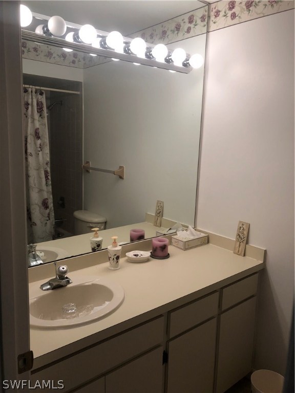 358 Delaware Road Lehigh Acres, FL 33936 - Photo 12 of 22 a bathroom with a sink and a mirror