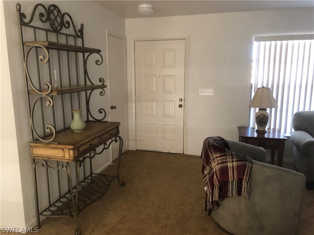 358 Delaware Road Lehigh Acres, FL 33936 - Photo 4 of 22 a view of hall way with furniture