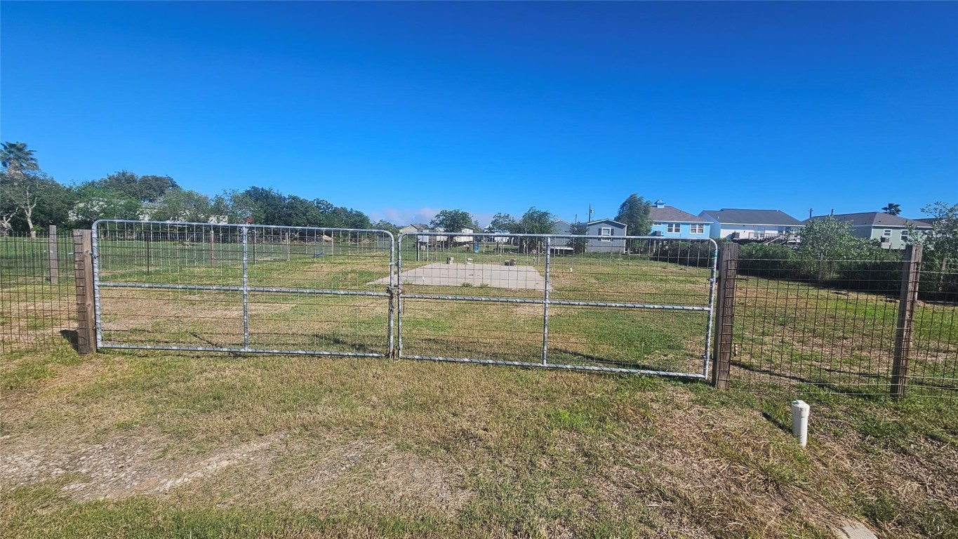 303 15th Street Dickinson, TX 77539 - Photo 1 of 6 a view of a lake with houses in the background