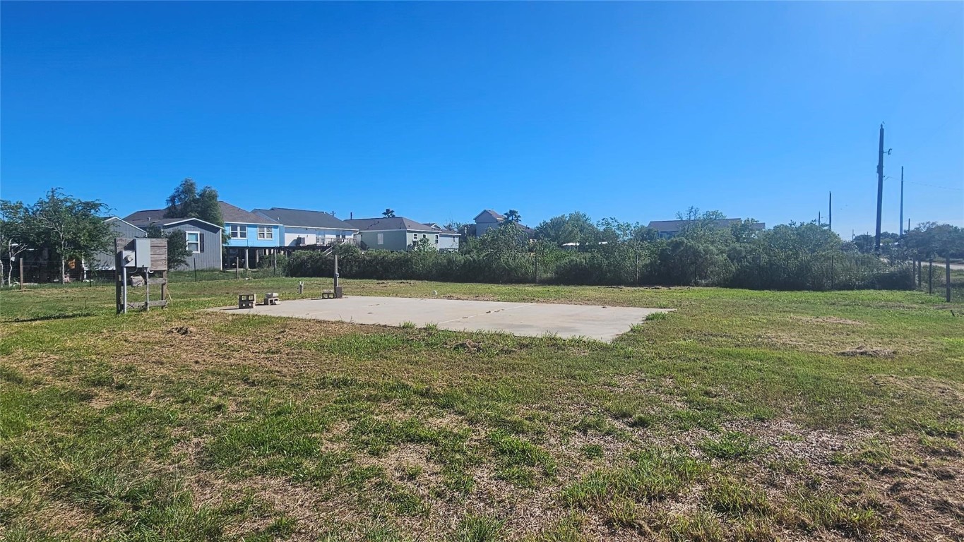 303 15th Street Dickinson, TX 77539 - Photo 2 of 6 a view of outdoor space with swimming pool and green space