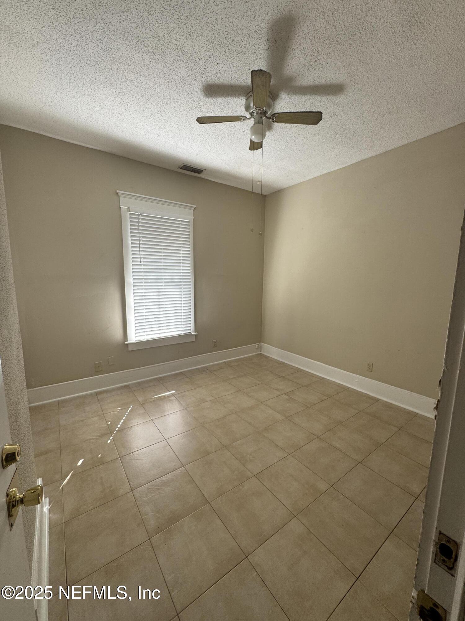 1604 Cherry Street, Unit 4 Jacksonville, FL 32205 - Photo 8 of 11 a view of an empty room with a window