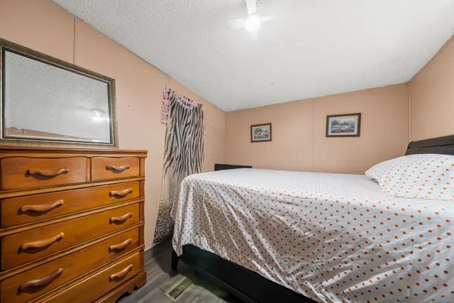 a bedroom with a bed and a cabinets