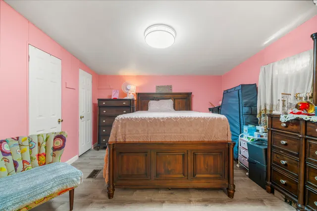 a bedroom with a bed and a dresser