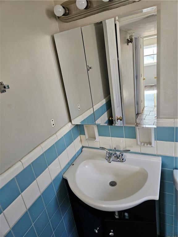 1907 Hanover Street, Unit 8 Swissvale, PA 15218 - Photo 11 of 23 a bathroom with a sink and a mirror