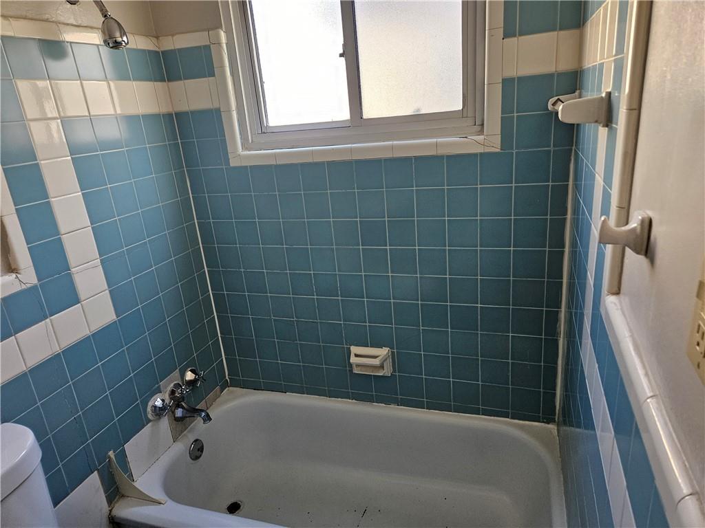 1907 Hanover Street, Unit 8 Swissvale, PA 15218 - Photo 13 of 23 a bathroom with a bathtub