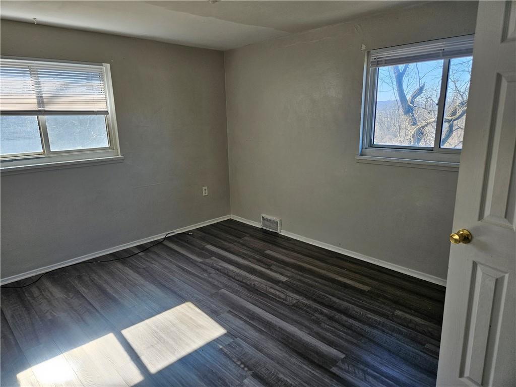 1907 Hanover Street, Unit 8 Swissvale, PA 15218 - Photo 22 of 23 a view of a room with wooden floor and window
