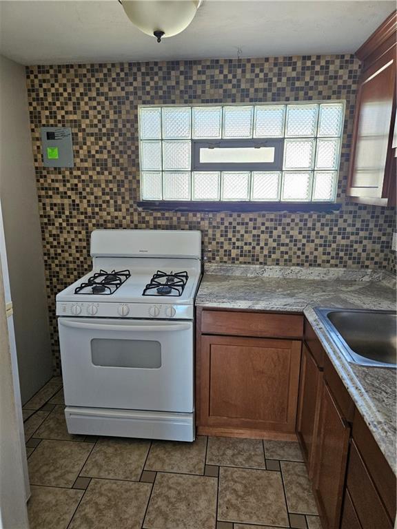 1907 Hanover Street, Unit 8 Swissvale, PA 15218 - Photo 6 of 23 a stove top oven sitting inside of a kitchen
