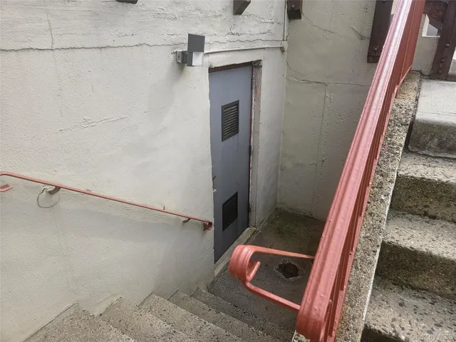 a view of a refrigerator in kitchen and window