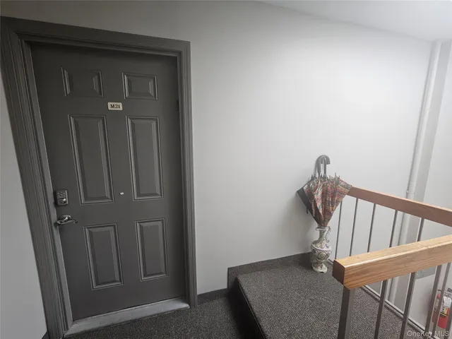 a view of a hallway with a door